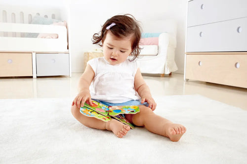 Toddler reading a book