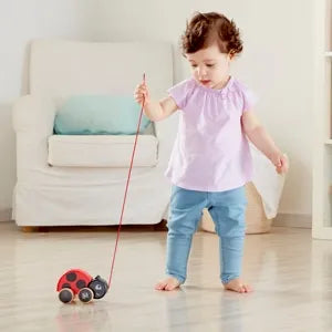 Toddler playing with a pull toy
