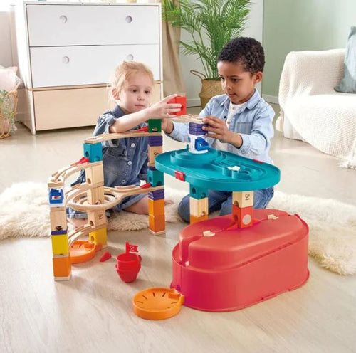 Quadrilla marble track being setup by children